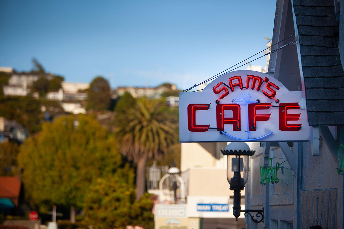 Sam's Cafe front door sign.